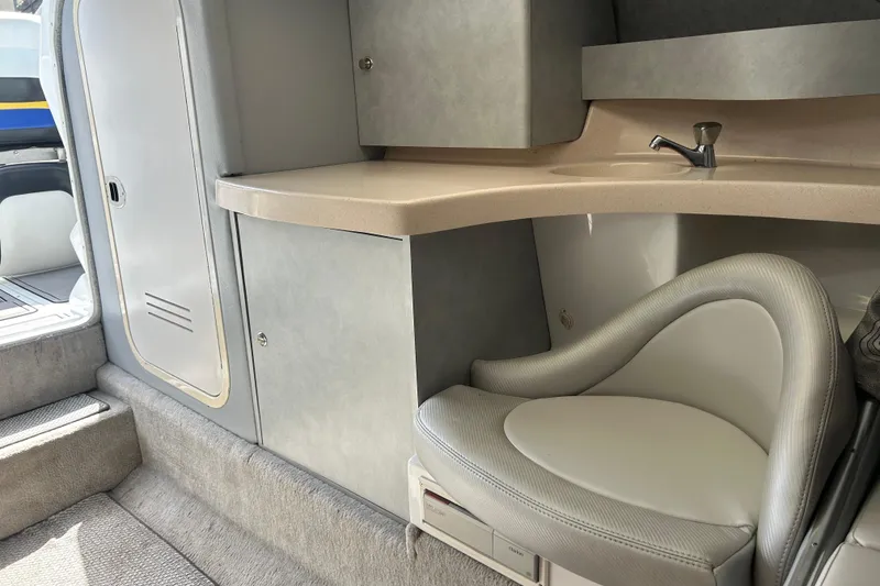 Slide: The Image of Interior of a 2005 Baha Cruisers 302 boat with seating and cabinetry. - 51