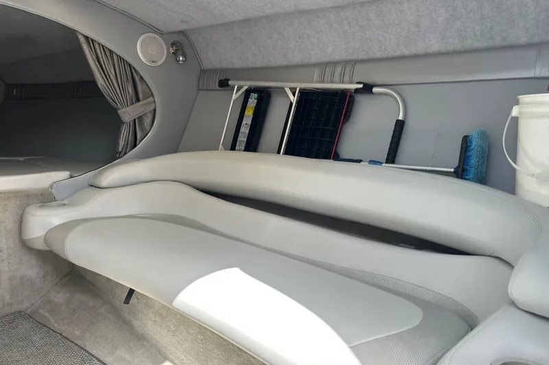 Slide: The Image of Interior of a 2005 Baha Cruisers 302 boat with seating and cleaning tools. - 43