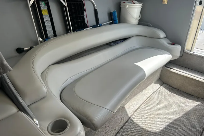 Slide: The Image of 2005 Baha Cruisers 302 boat interior with curved seating and cup holder. - 58