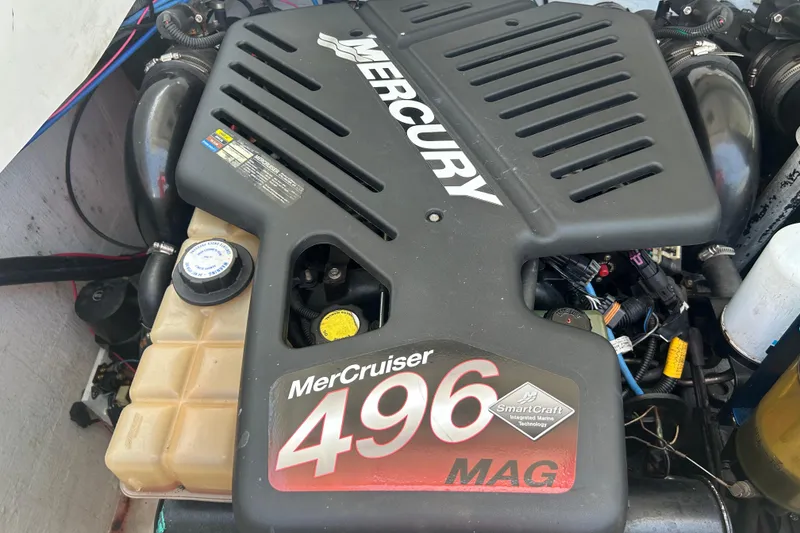 Slide: The Image of MerCruiser 496 MAG engine in a 2005 Baha Cruisers 302 boat, showcasing SmartCraft technology. - 75