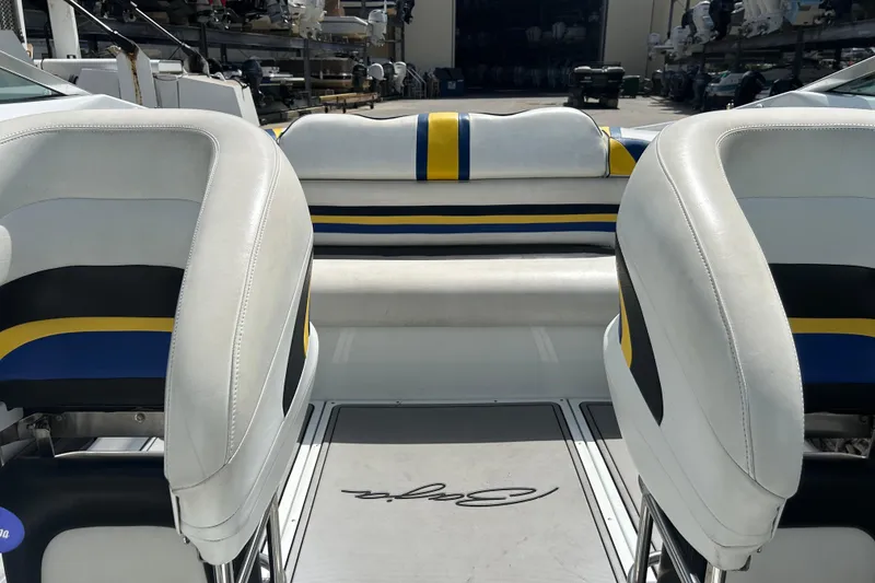 Slide: The Image of 2005 Baha Cruisers 302 boat interior with white, blue, and yellow seating. - 61