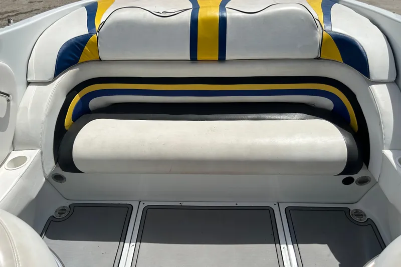 Slide: The Image of 2005 Baha Cruisers 302 boat interior with colorful seating and cup holder. - 62