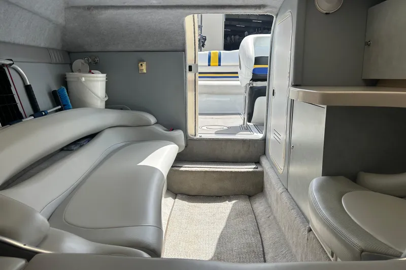 Slide: The Image of Interior of a 2005 Baha Cruisers 302 boat, featuring seating and storage areas. - 55
