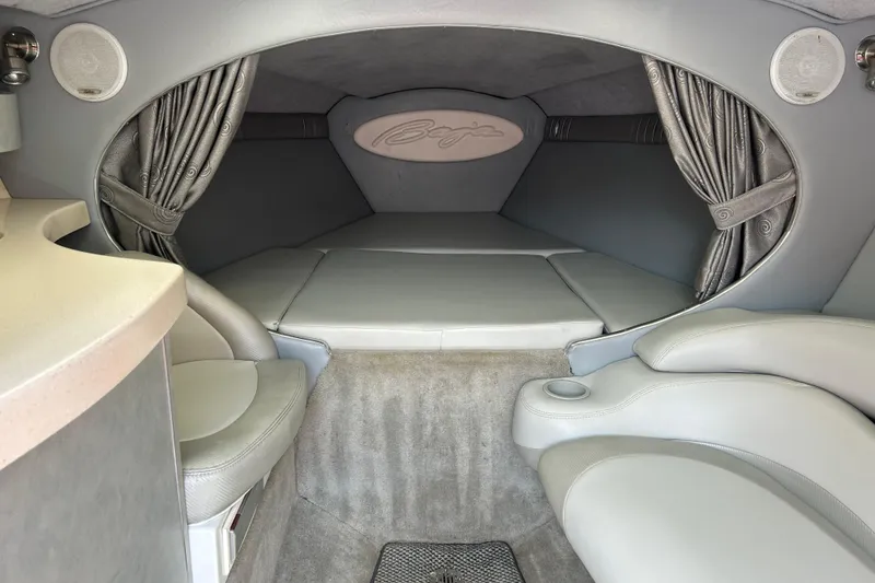 Slide: The Image of Interior cabin of a 2005 Baha Cruisers 302 boat, featuring plush seating and elegant design. - 48
