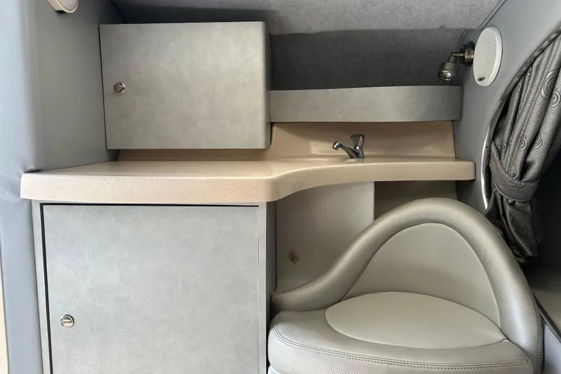 Slide: The Image of 2005 Baha Cruisers 302 cabin interior with sink, storage, and seating. - 50