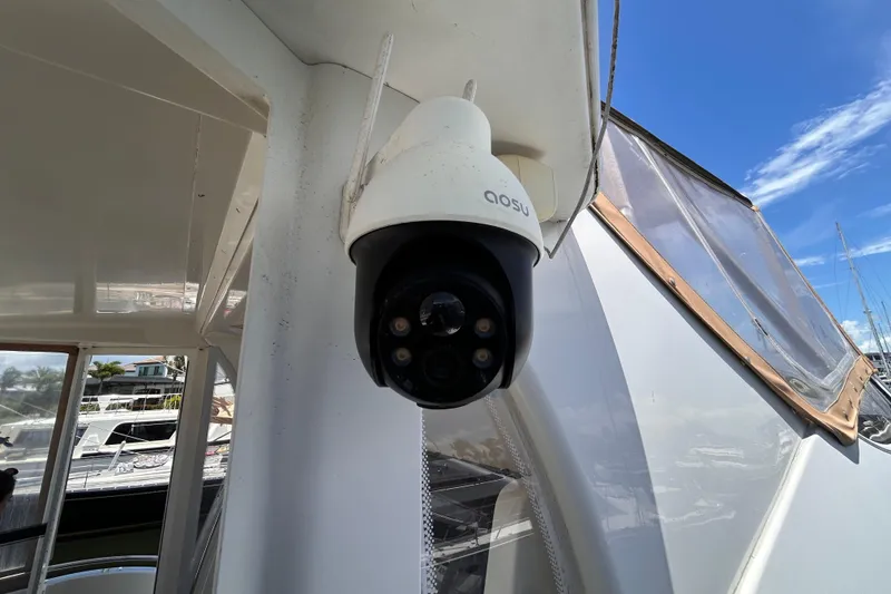 Slide: The Image of Security camera on 2005 Carver 36 Motor Yacht, docked under clear blue sky. - 15