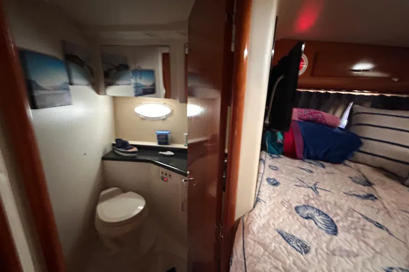 Slide: The Image of Interior of 2005 Carver 36 Motor Yacht with bathroom and cozy bedroom. - 101