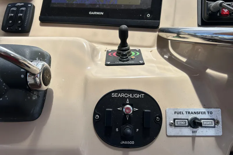 Slide: The Image of Control panel of a 2005 Carver 36 Motor Yacht with searchlight and fuel transfer switches. - 43