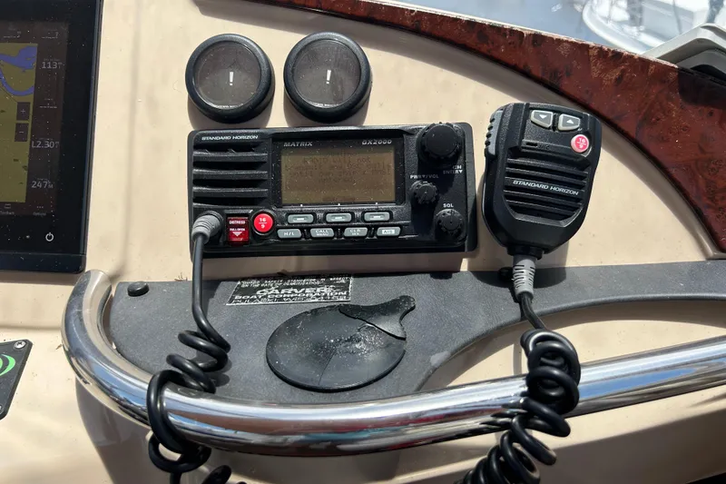 Slide: The Image of Control panel of a 2005 Carver 36 Motor Yacht with radio equipment. - 44