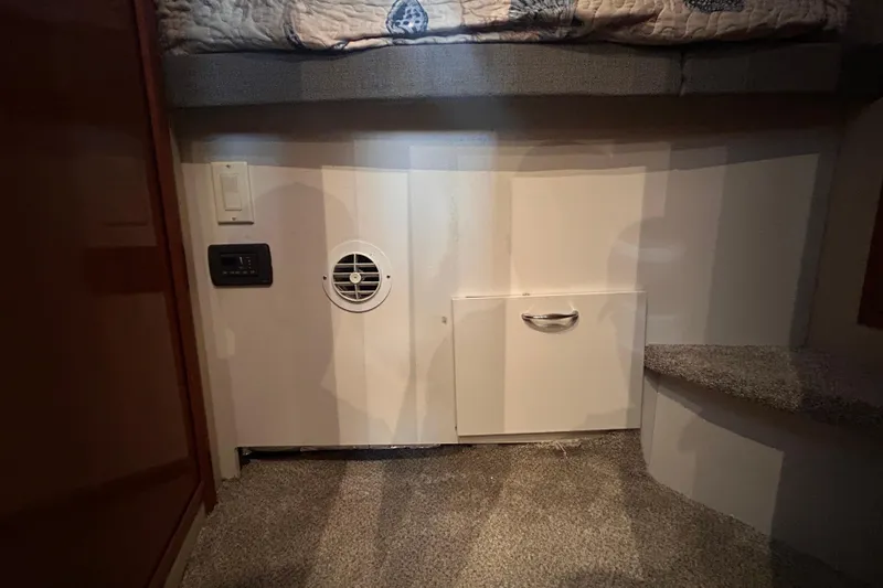 Slide: The Image of Interior of 2005 Carver 36 Motor Yacht showing storage and ventilation features. - 96