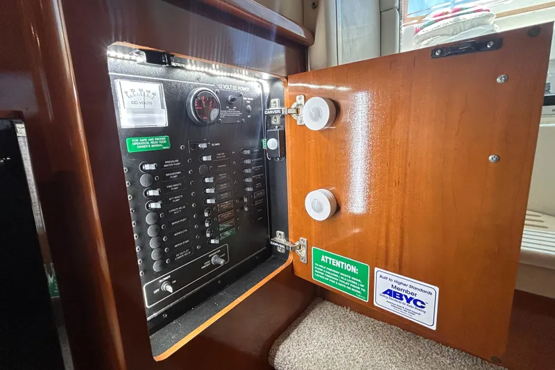 Slide: The Image of Electrical panel inside a 2005 Carver 36 Motor Yacht, featuring switches and gauges. - 143