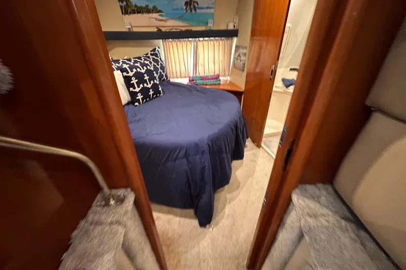 Slide: The Image of Interior cabin of 2005 Carver 36 Motor Yacht with nautical-themed bedding. - 119