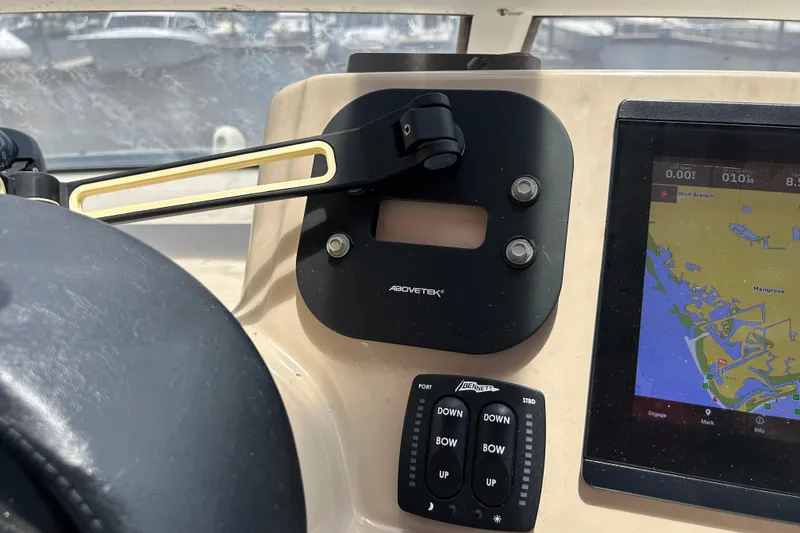 Slide: The Image of Dashboard of a 2005 Carver 36 Motor Yacht with navigation display and controls. - 40