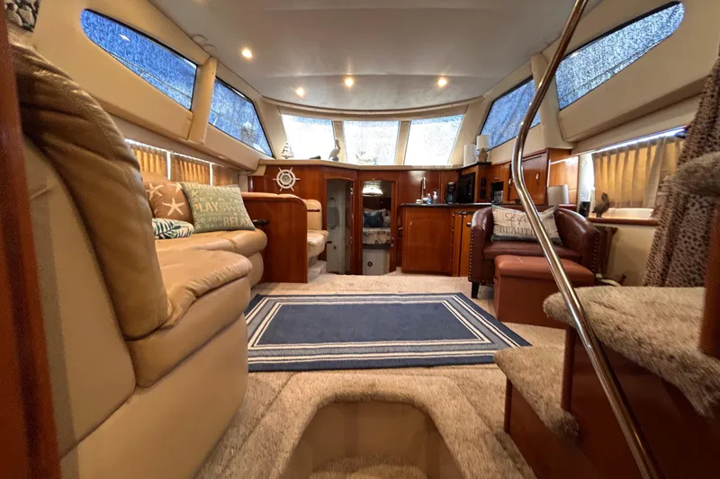 Slide: The Image of Luxurious interior of 2005 Carver 36 Motor Yacht with plush seating and elegant decor. - 130