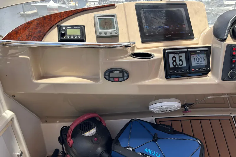 Slide: The Image of Control panel of a 2005 Carver 36 Motor Yacht with navigation instruments and displays. - 28