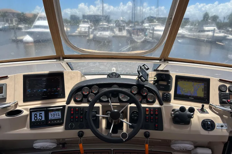 Slide: The Image of Cockpit view of 2005 Carver 36 Motor Yacht with navigation instruments and steering wheel. - 26