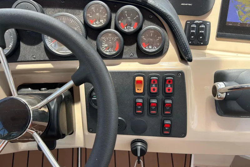 Slide: The Image of Steering wheel and control panel of 2005 Carver 36 Motor Yacht cockpit. - 34