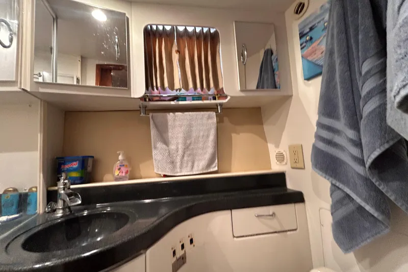 Slide: The Image of Bathroom interior of 2005 Carver 36 Motor Yacht with sink and towels. - 125