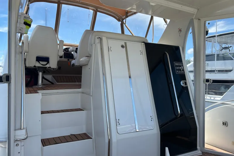 Slide: The Image of 2005 Carver 36 Motor Yacht interior with helm and seating area. - 22