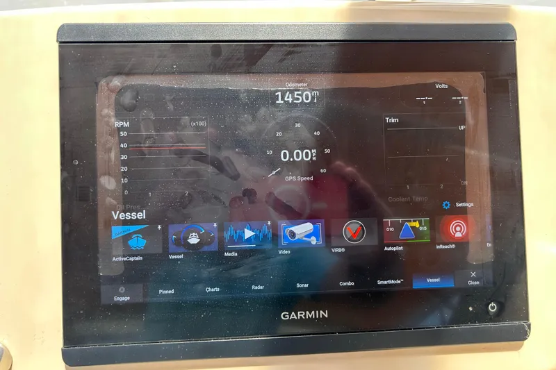 Slide: The Image of Garmin display on 2005 Carver 36 Motor Yacht showing vessel data and navigation options. - 42