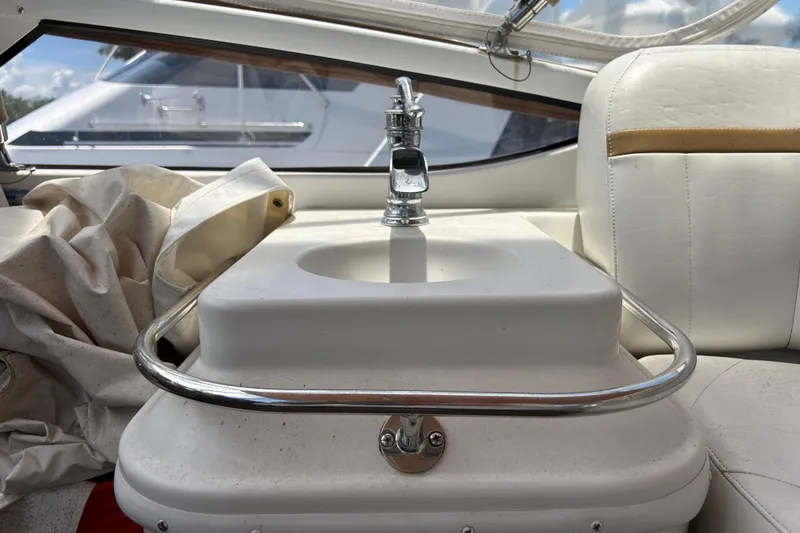 Slide: The Image of Interior of 2005 Carver 36 Motor Yacht featuring a compact sink and seating area. - 48