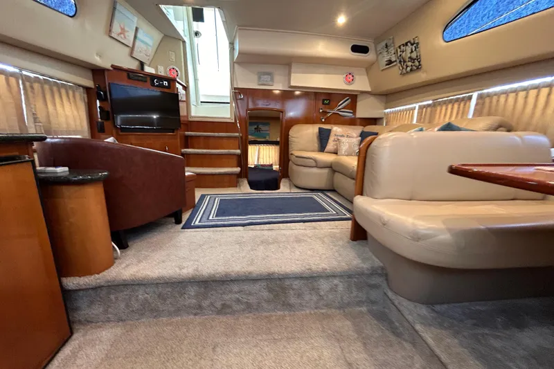 Slide: The Image of Luxurious interior of a 2005 Carver 36 Motor Yacht with plush seating and modern amenities. - 105