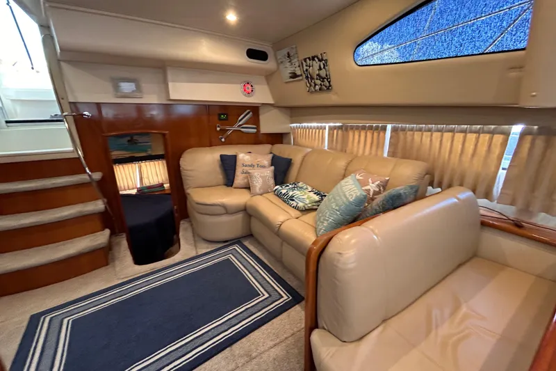Slide: The Image of Interior of 2005 Carver 36 Motor Yacht with cozy seating and nautical decor. - 106