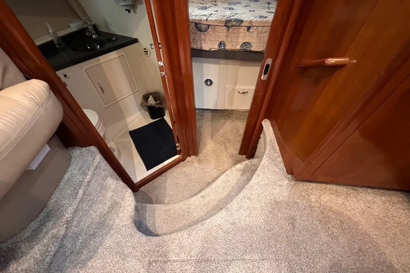 Slide: The Image of Interior of 2005 Carver 36 Motor Yacht showing bathroom and bedroom entrance. - 88
