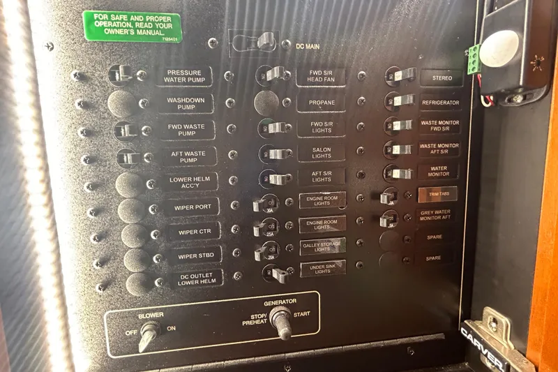 Slide: The Image of Control panel of a 2005 Carver 36 Motor Yacht with labeled switches and indicators. - 144
