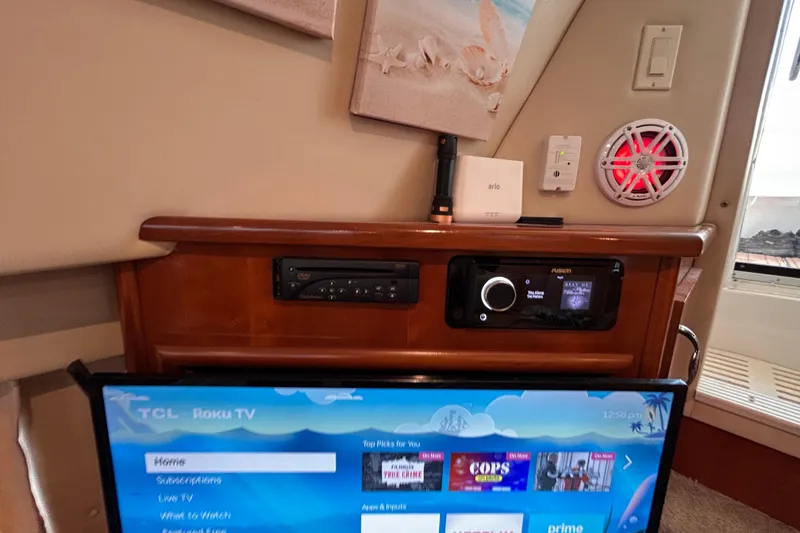 Slide: The Image of Interior of 2005 Carver 36 Motor Yacht with entertainment system and TCL Roku TV. - 110