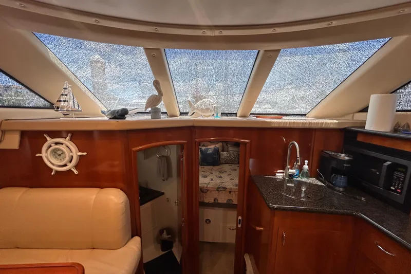 Slide: The Image of Interior of 2005 Carver 36 Motor Yacht with kitchen and cozy cabin view. - 93