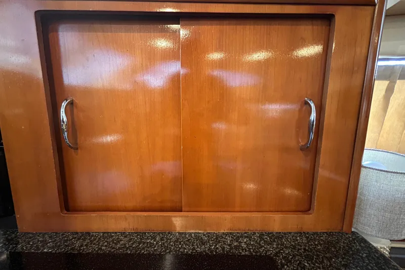 Slide: The Image of Wooden cabinet with sliding doors on a 2005 Carver 36 Motor Yacht. - 83