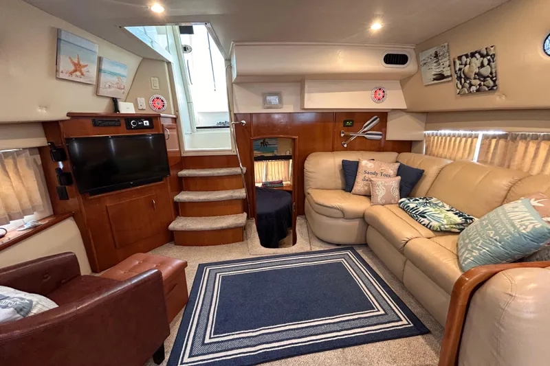 Slide: The Image of Luxurious interior of 2005 Carver 36 Motor Yacht with cozy seating and nautical decor. - 107