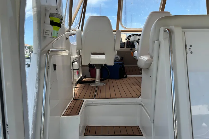 Slide: The Image of Interior view of 2005 Carver 36 Motor Yacht cockpit with seating and controls. - 24