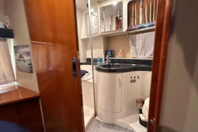 Slide: The Image of Interior of 2005 Carver 36 Motor Yacht bathroom with sink, shower, and storage. - 123