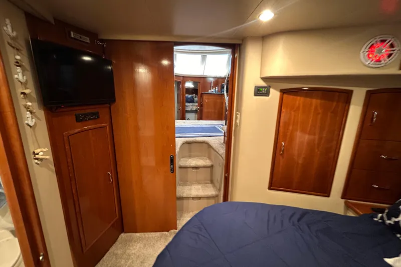 Slide: The Image of Interior of 2005 Carver 36 Motor Yacht with wood cabinetry and cozy bedroom. - 129