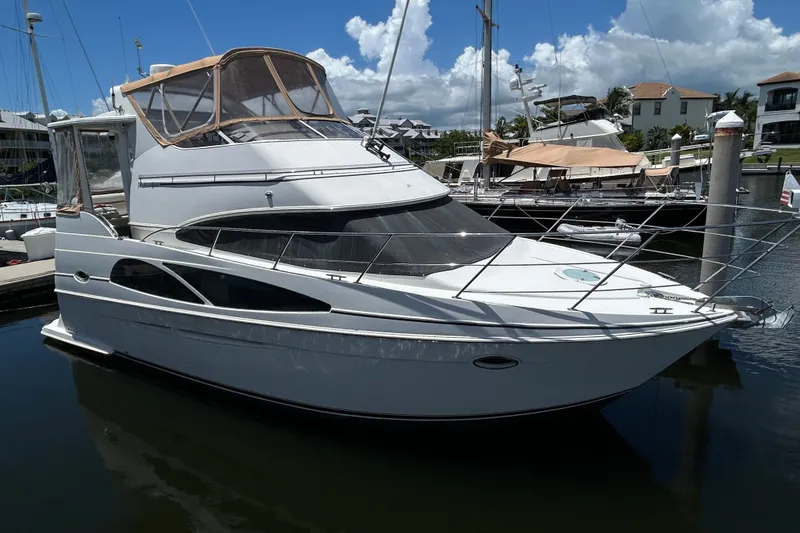 The Image of 2005 Carver 36 Motor Yacht docked in a marina under a clear blue sky. - 0