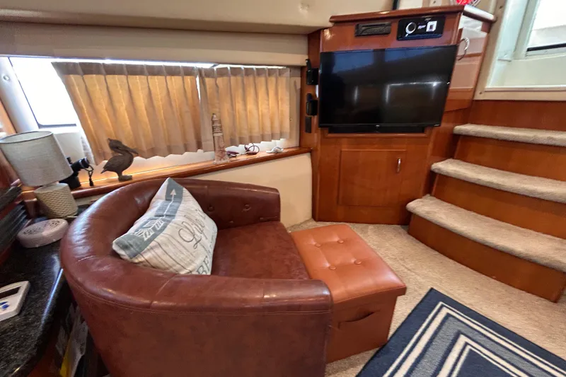 Slide: The Image of Luxurious interior of 2005 Carver 36 Motor Yacht with leather chair and TV. - 108