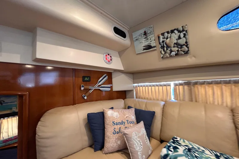 Slide: The Image of Interior of 2005 Carver 36 Motor Yacht with cozy seating and nautical decor. - 117