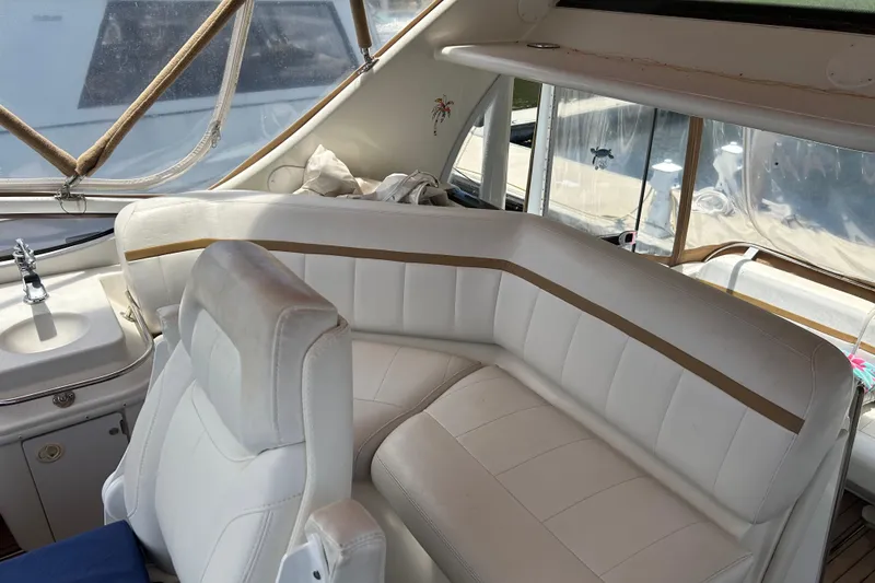 Slide: The Image of Interior of 2005 Carver 36 Motor Yacht with white seating and compact sink. - 47