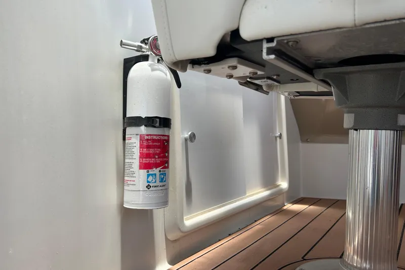 Slide: The Image of Fire extinguisher mounted on 2005 Carver 36 Motor Yacht's deck near seating area. - 45