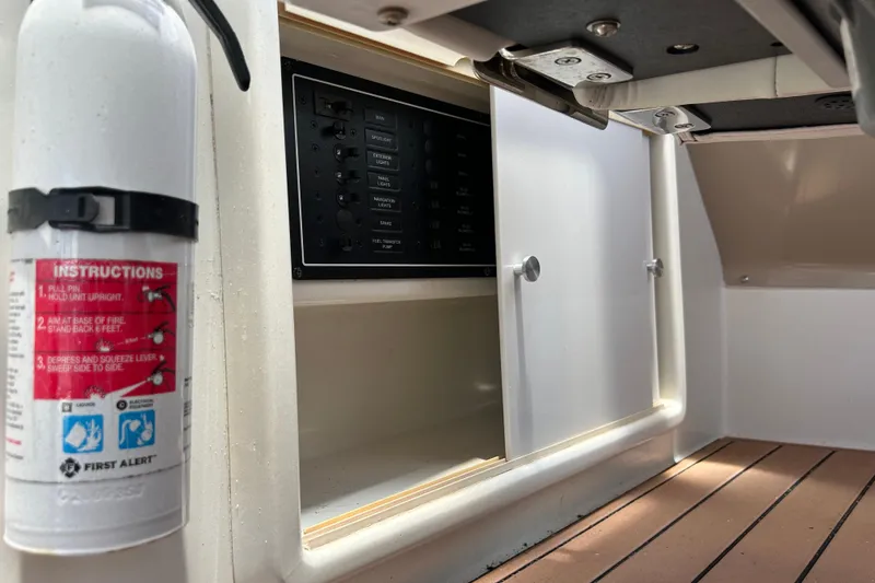 Slide: The Image of Fire extinguisher and control panel on 2005 Carver 36 Motor Yacht interior. - 46