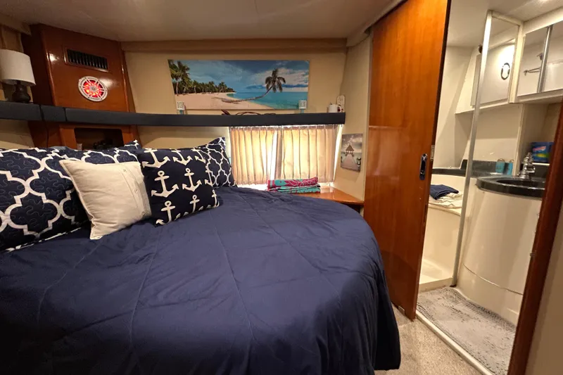 Slide: The Image of Interior of 2005 Carver 36 Motor Yacht with cozy bedroom and ensuite bathroom. - 122
