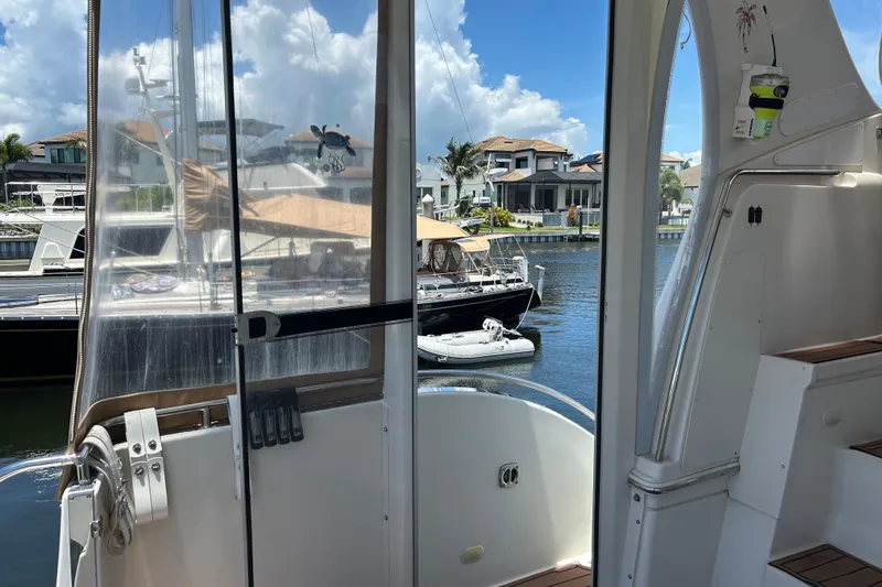 Slide: The Image of 2005 Carver 36 Motor Yacht interior view with marina backdrop. - 16