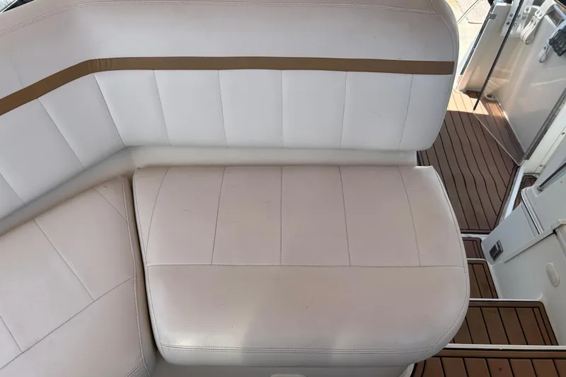 Slide: The Image of White leather seating on 2005 Carver 36 Motor Yacht with teak flooring. - 53