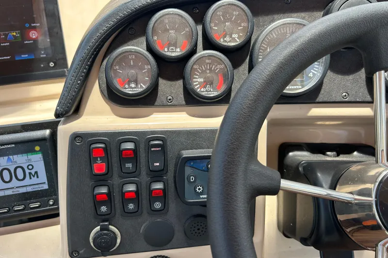 Slide: The Image of Dashboard of a 2005 Carver 36 Motor Yacht with gauges and controls. - 33