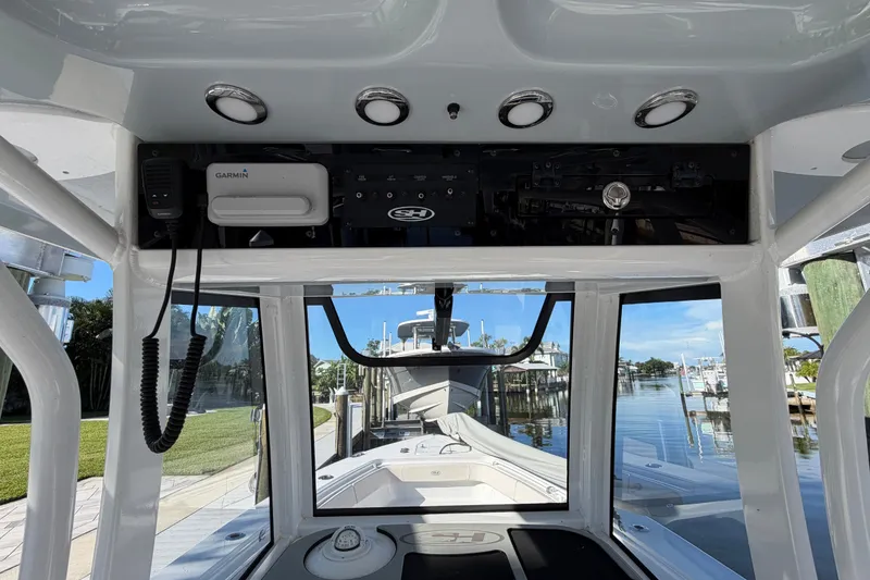 Slide: The Image of Interior view of 2025 Sea Hunt Gamefish 27CB boat with Garmin equipment. - 28