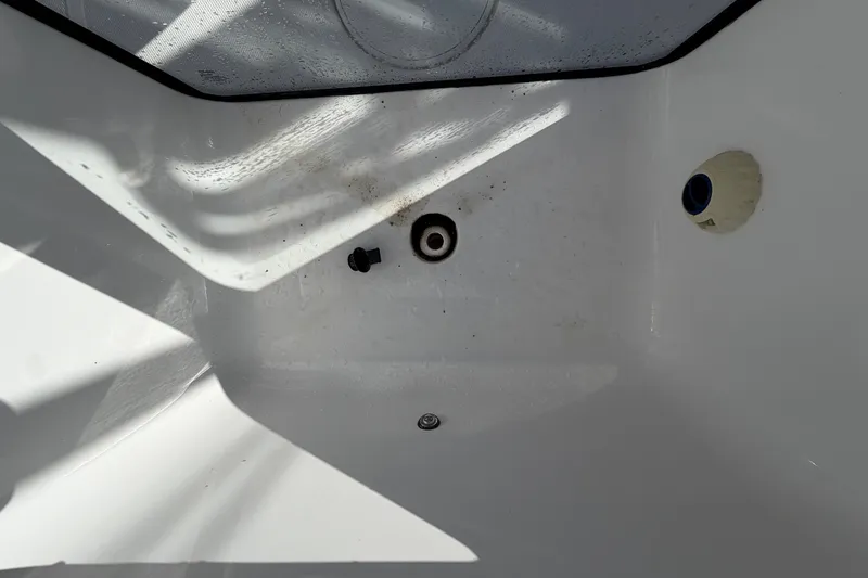 Slide: The Image of Interior view of 2025 Sea Hunt Gamefish 27CB boat, showing drainage area and fittings. - 18
