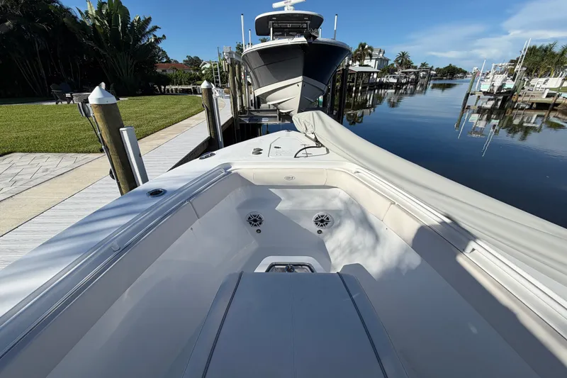 Slide: The Image of 2025 Sea Hunt Gamefish 27CB docked, showcasing spacious deck and sleek design. - 45