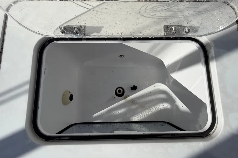 Slide: The Image of Open storage compartment on 2025 Sea Hunt Gamefish 27CB boat. - 17
